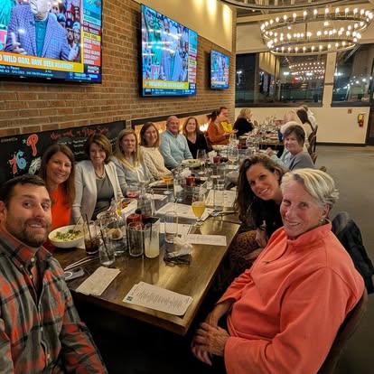 Quinn & Wilson team and friends sharing a meal together