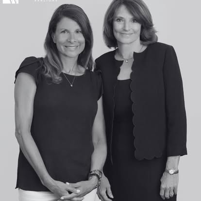 Two Quinn & Wilson professionals photographed together